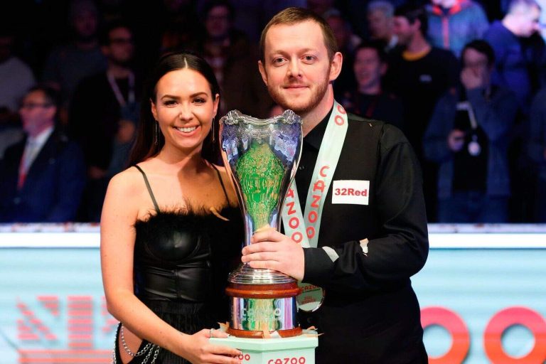 Mark Allen celebrates with wife-to-be Aideen Cassidy following his Cazoo UK Snooker Championship vic